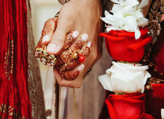 authentic-indian-bride-groom-s-hands-holding-together-traditional-wedding-attire_8353-10049